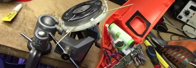 Vacuum cleaner repair parts and tools on a workbench in Salt Lake City, UT