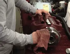 Vacuum repair technician cleaning and servicing a vacuum motor in Salt Lake City, UT